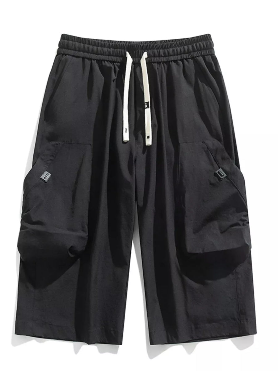 Black cargo capris with adjustable drawstring and large side pockets.