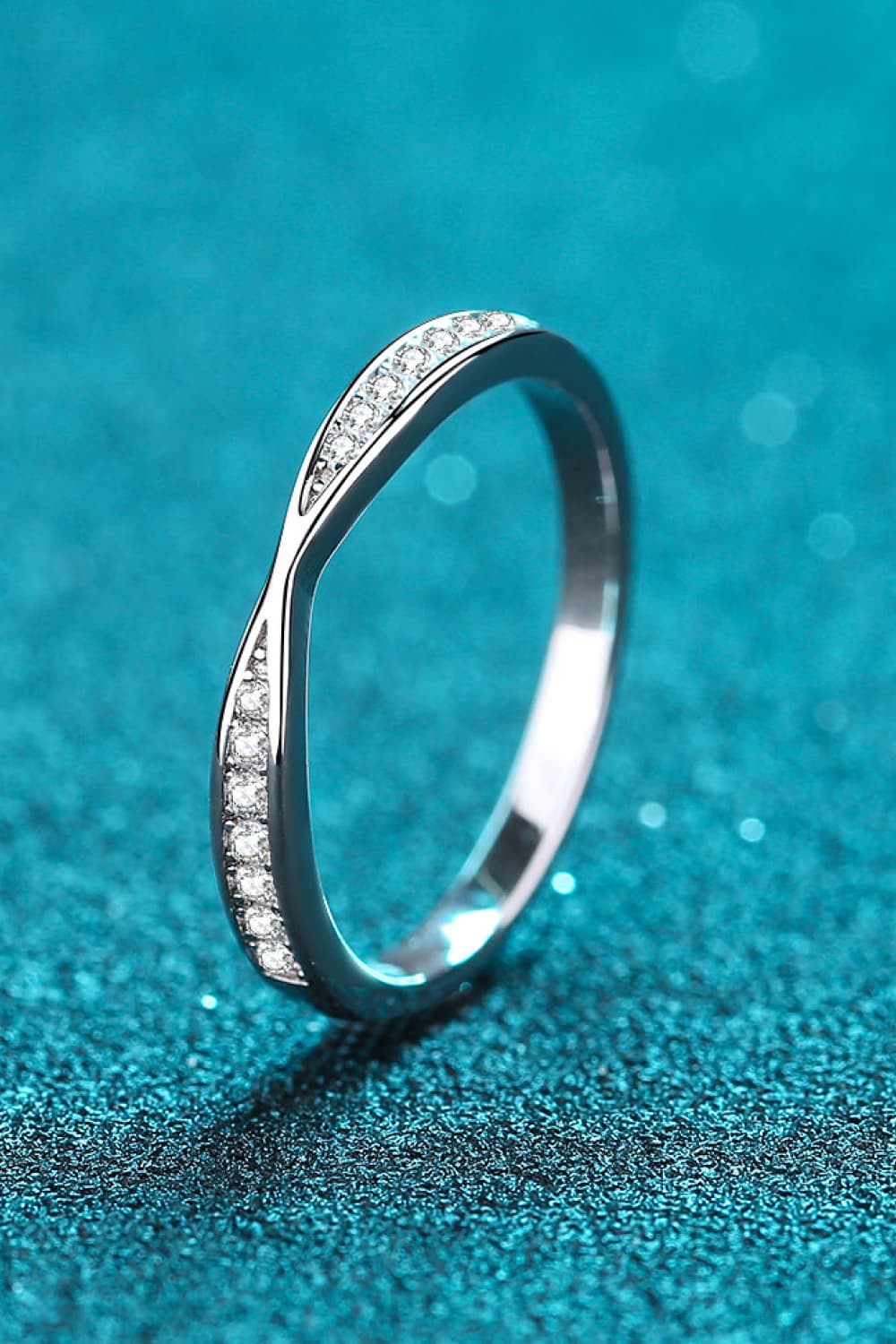 Silver twisted pavé band ring with clear stones