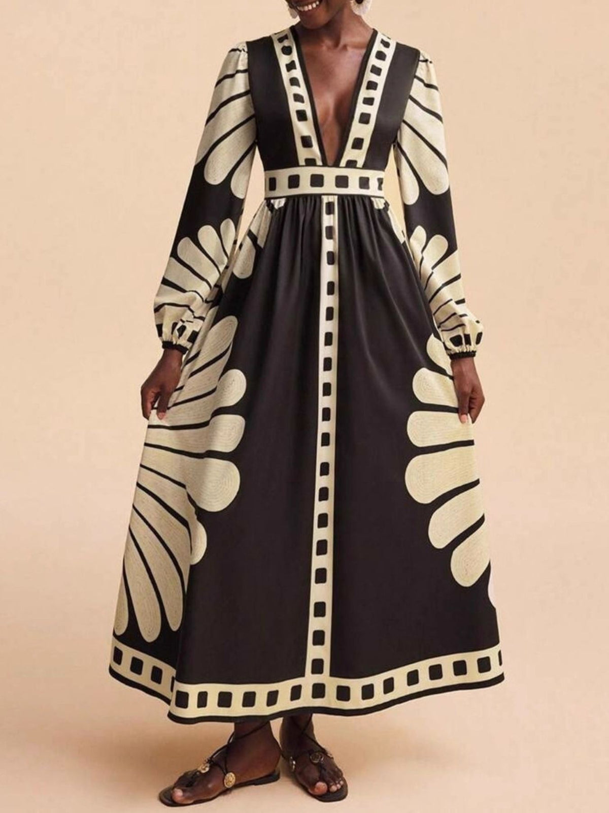 Black and cream geometric print maxi dress with deep V-neck and long sleeves