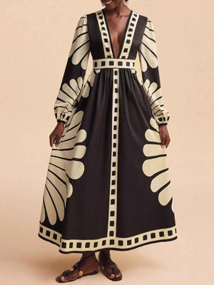 Black and cream geometric print maxi dress with deep V-neck and long sleeves