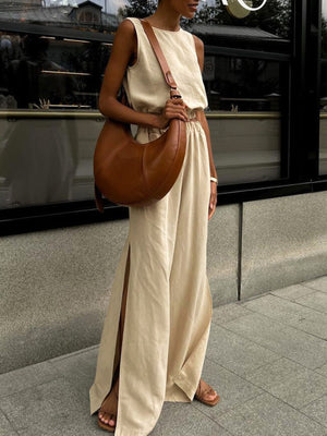 Tan sleeveless crop top and wide-leg pants set with crew neck and high slits.