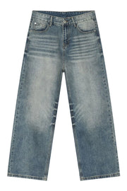 Baggy wash denim trousers in medium blue with a faded, distressed look and wide leg.