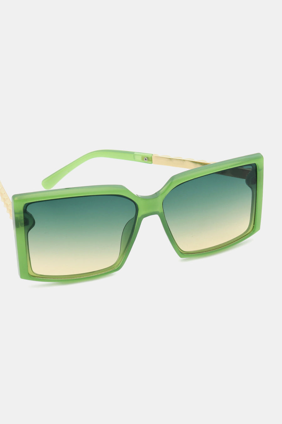 Green geometric sunglasses with gradient lenses and gold accents.
