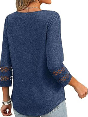 Blue 3/4 sleeve t-shirt with cutout detail on sleeves.