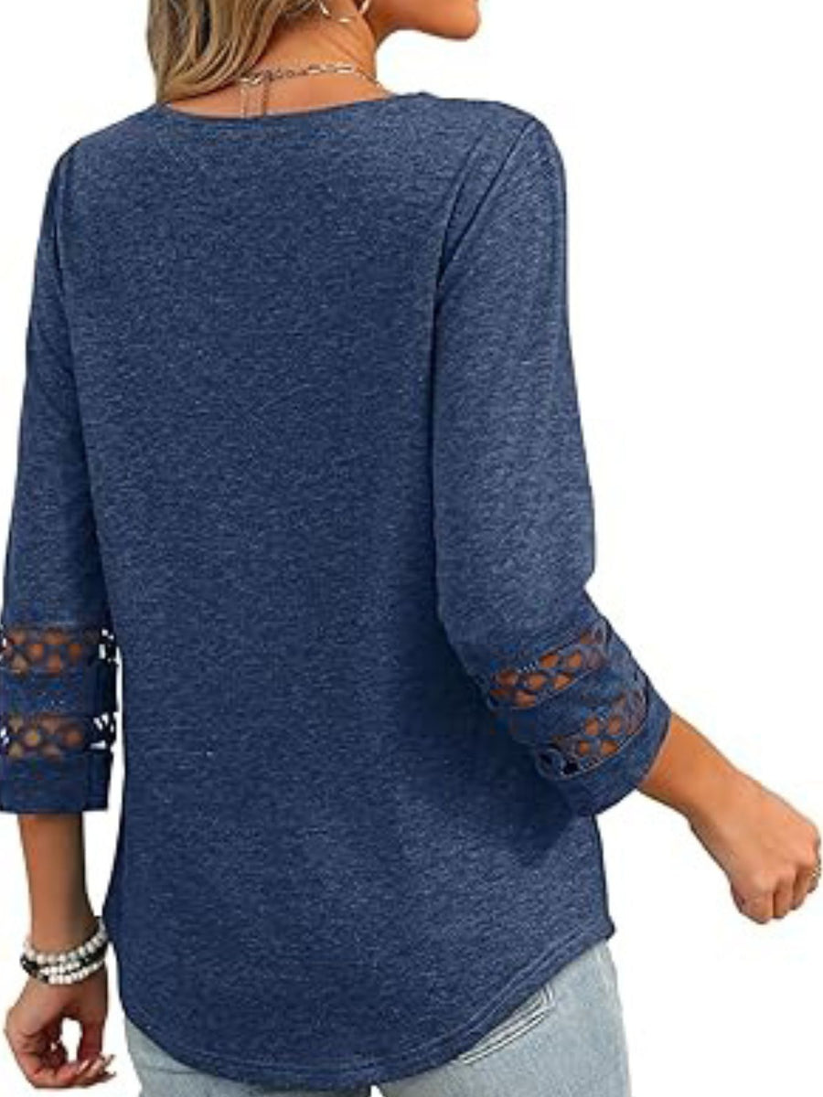 Blue 3/4 sleeve t-shirt with cutout detail on sleeves.