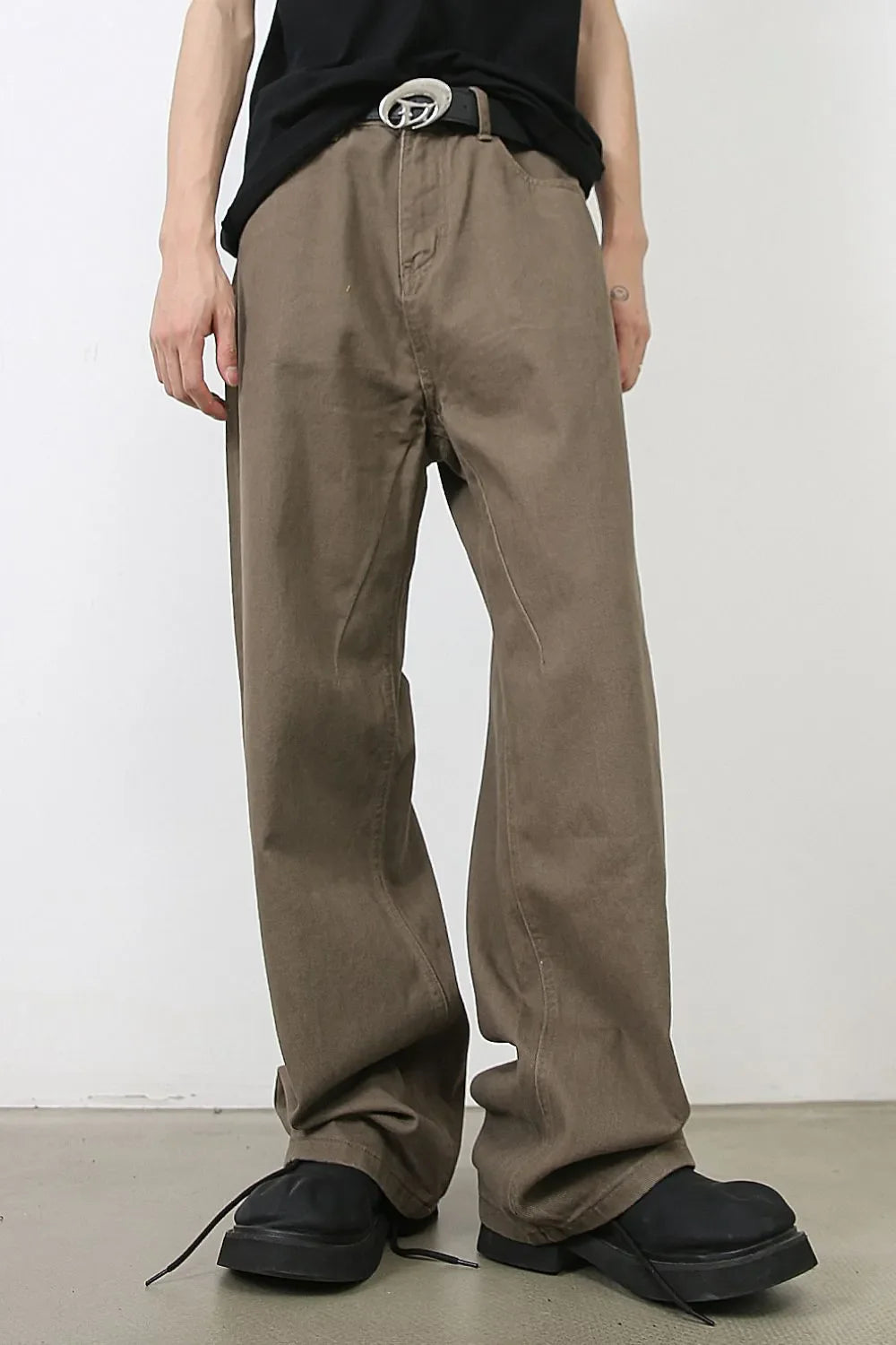 Taupe wide-leg denim trousers with a relaxed fit and casual styling.