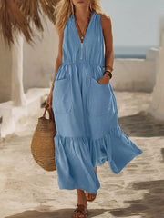 Sky blue maxi dress with V-neck, zip, elastic waist, pockets, and ruffled hem.