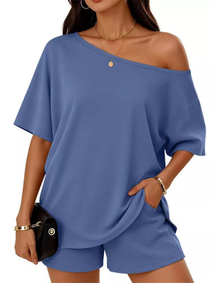 two-piece set in Black with one-shoulder and hip-length