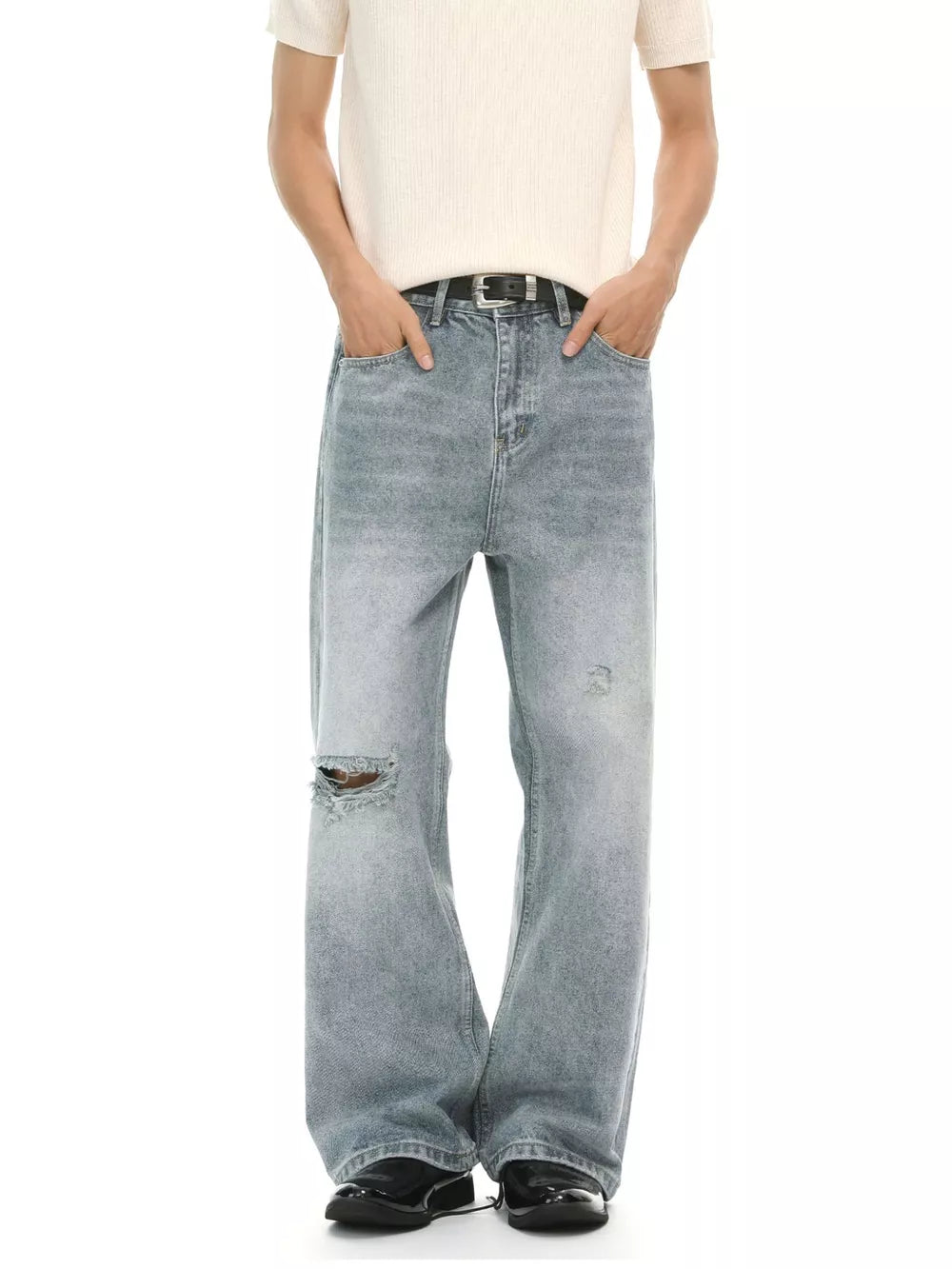 Rugged wide-leg denim jeans for men in light wash with distressed details and a relaxed fit.