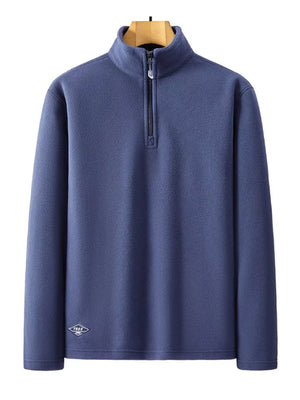 Men's blue fleece quarter zip sweatshirt with a diamond logo detail.