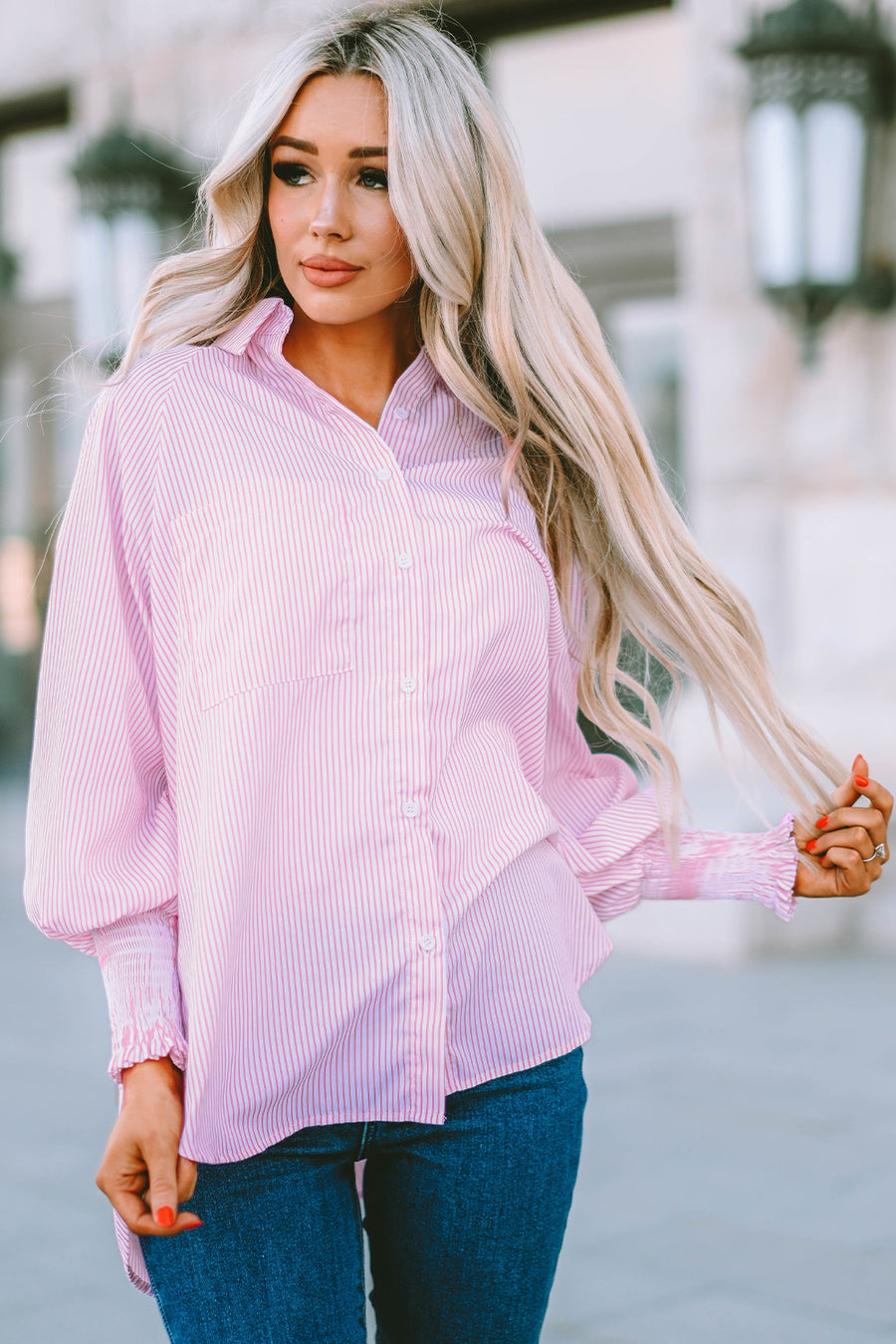 Blush pink pinstripe blouse with balloon sleeves and ruched cuffs.