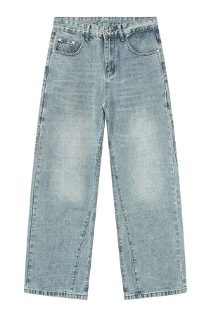 Baggy denim jeans in medium wash with subtle fading and a wide leg.