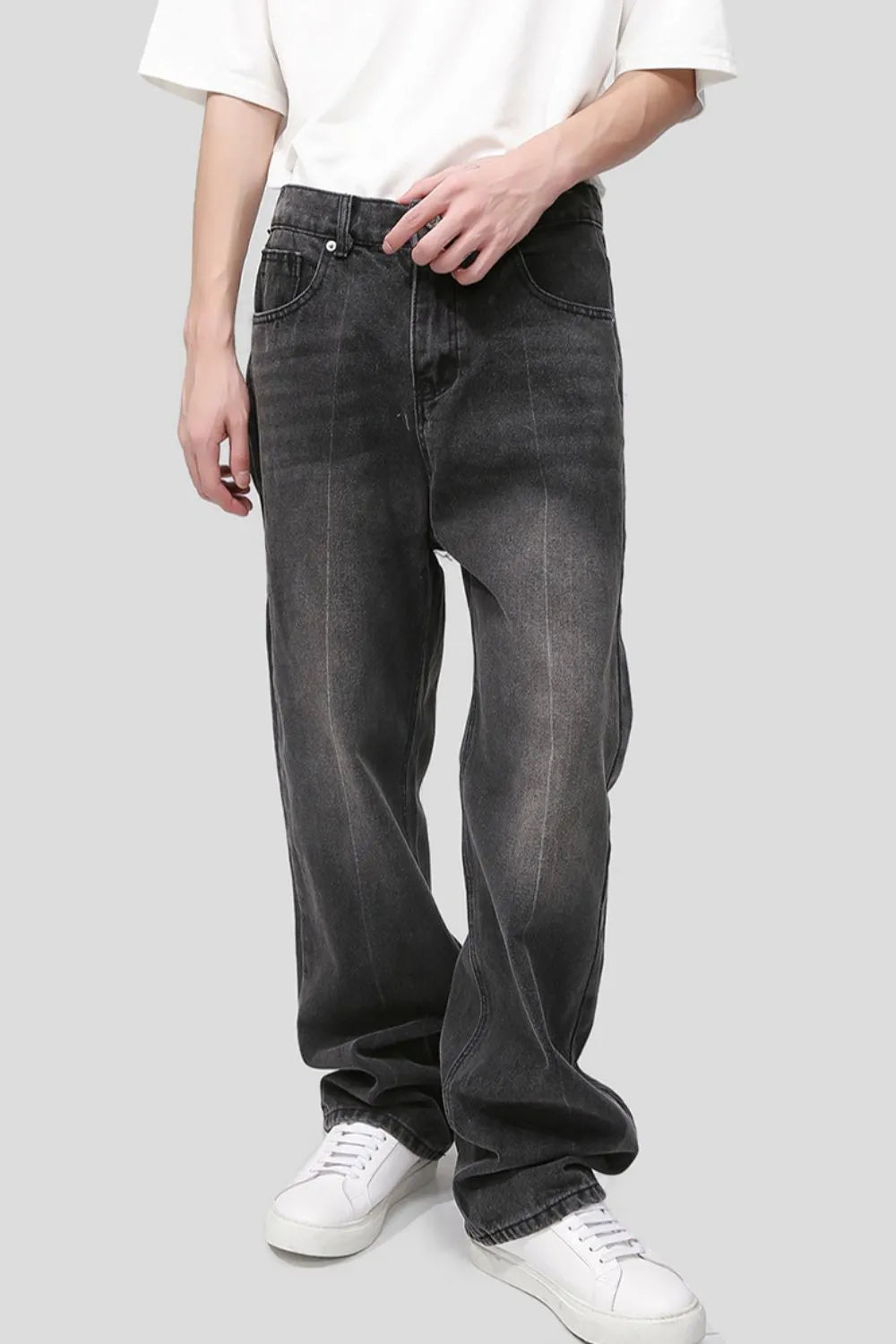Pocketed dark wash denim jeans with a relaxed fit and vertical seam detail.