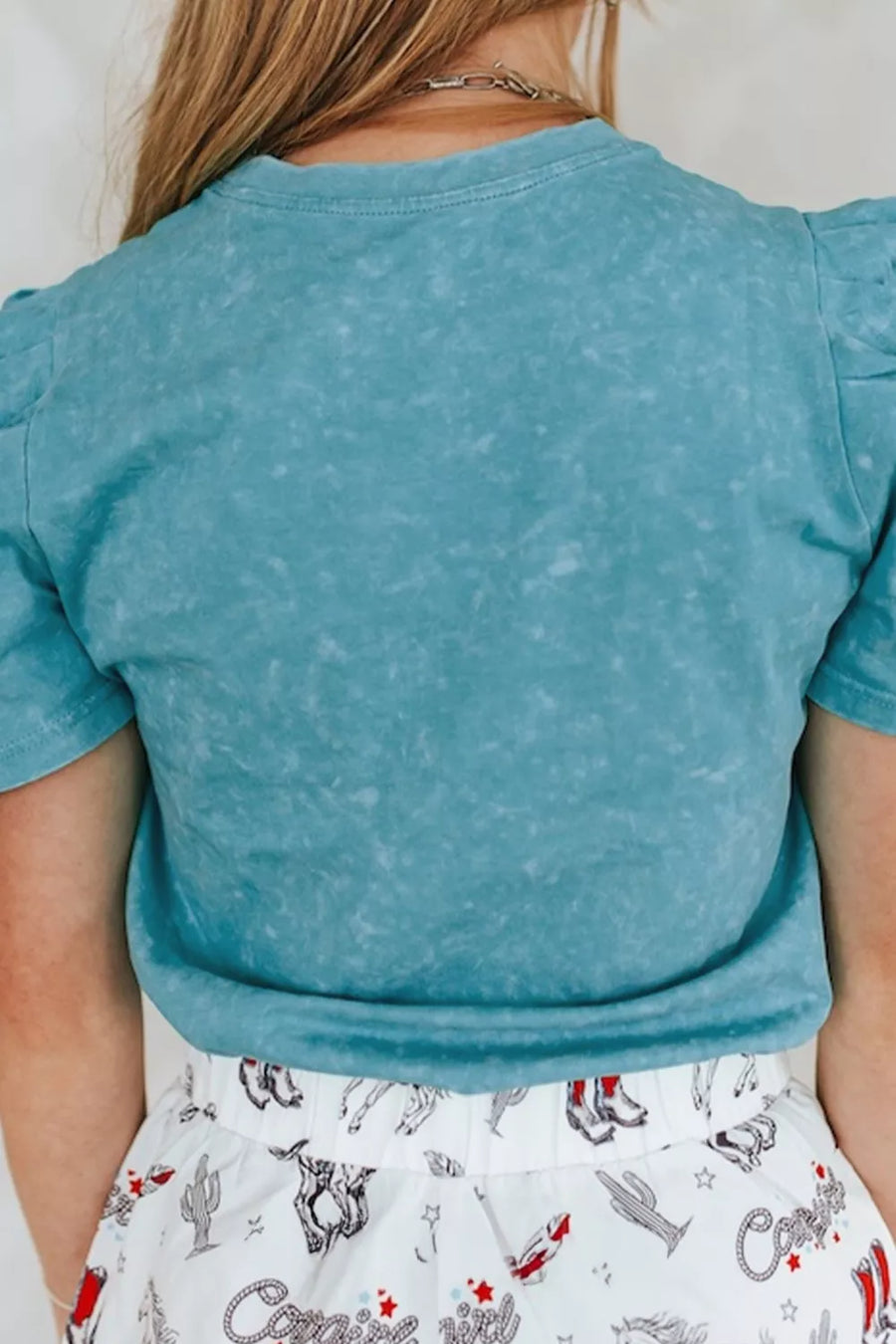 Teal mineral wash cotton t-shirt with puff sleeves and crew neck.