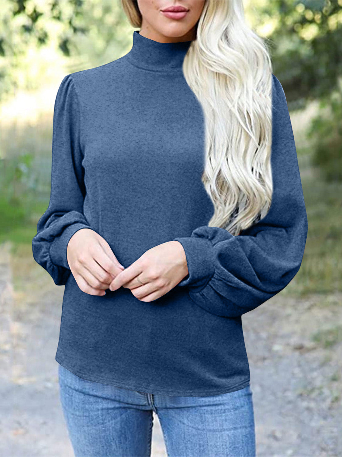 Dusty blue mock neck top with puff sleeves and button back detail