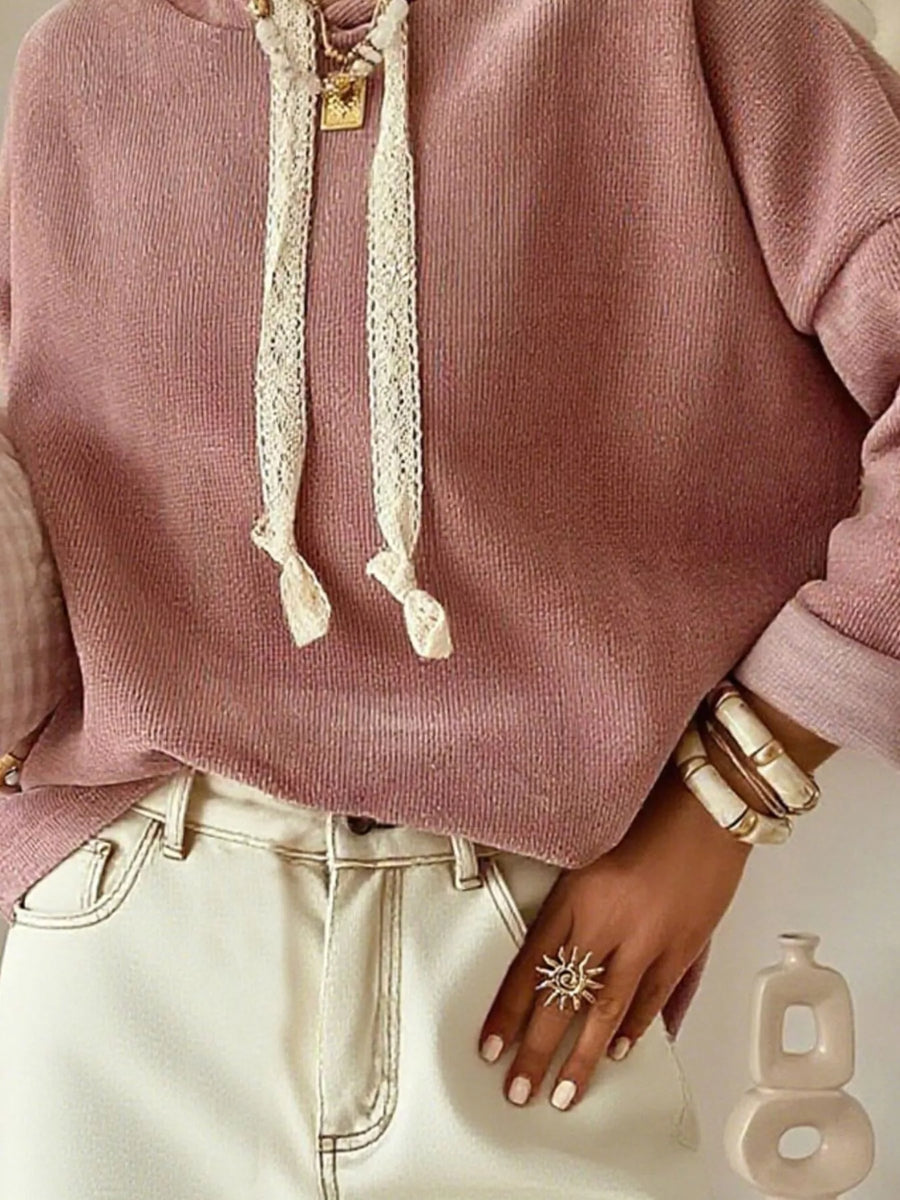 Dusty pink dropped shoulder hoodie with lace drawstrings and rolled cuffs.