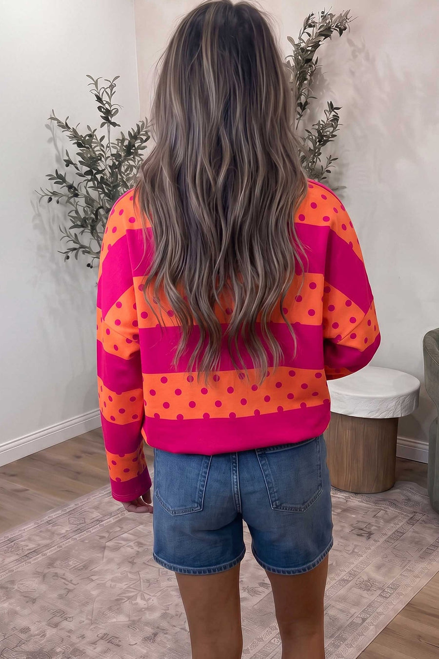 orange sweatshirt featuring zipper and polka dot