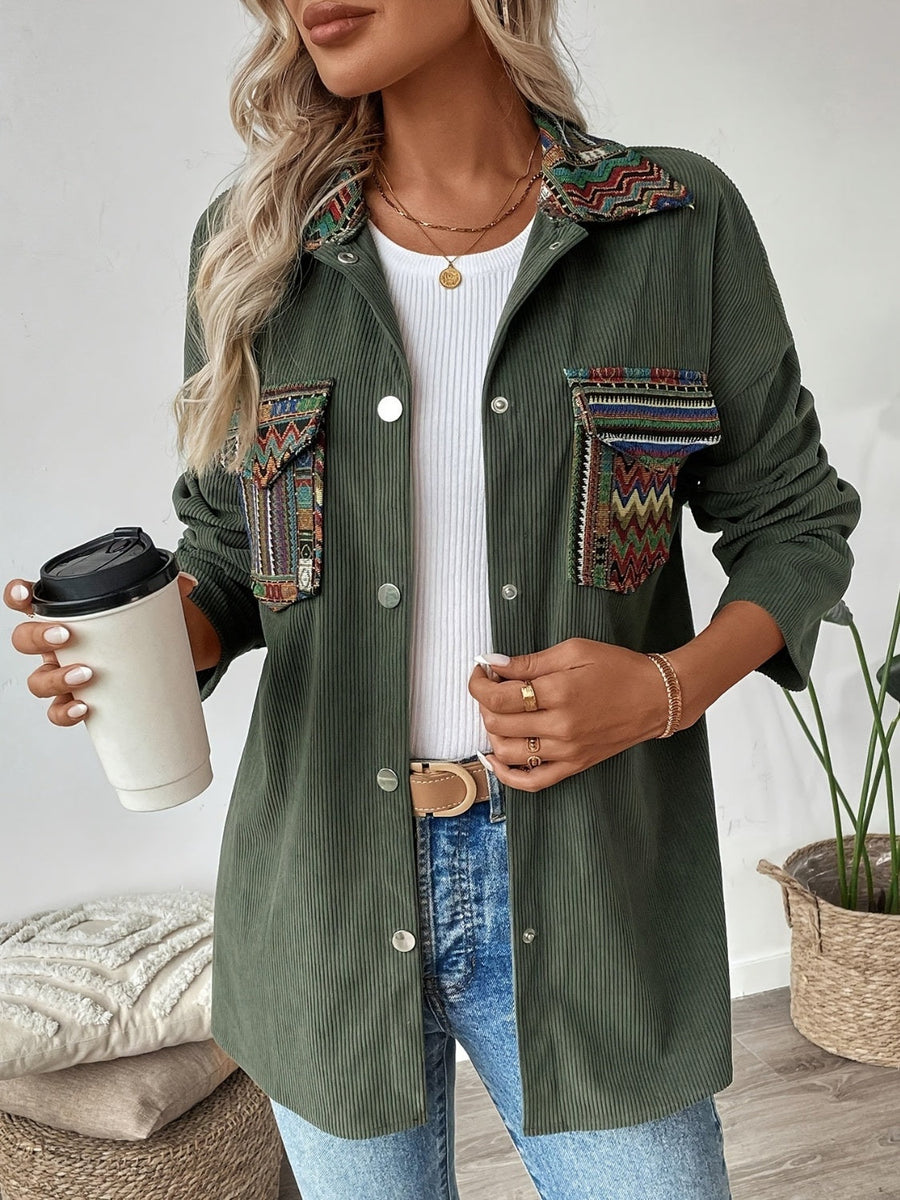 Army green corduroy overshirt with embroidered statement pockets and collar detail.