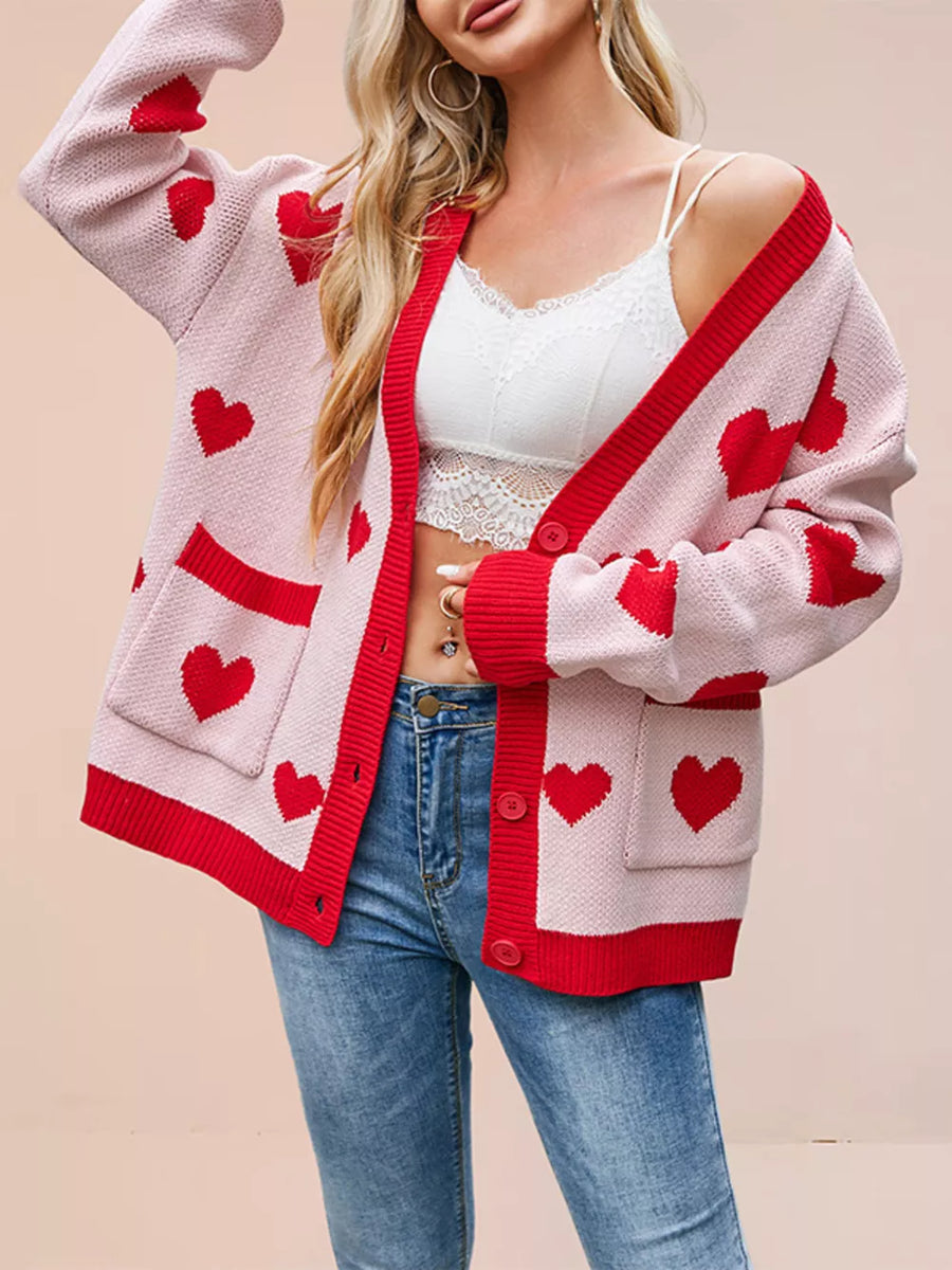light pink cardigan with heart-print and v-neck