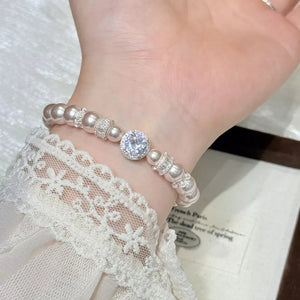 Synthetic Pearl,Alloy,Zircon Care instructions: Avoid wearing during exercise, a bracelet in silver with fitted silhouette