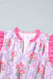 Women's pink floral dress with ruffled neckline and sleeves, bow and polka dot print