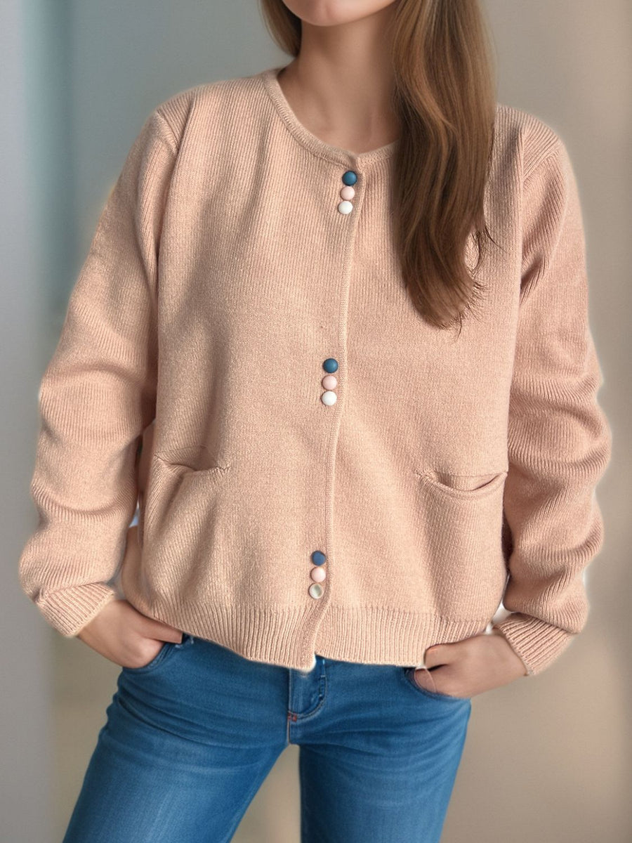 Dusty Pink ribbed knit button-up cardigan with playful pastel buttons and front pockets.