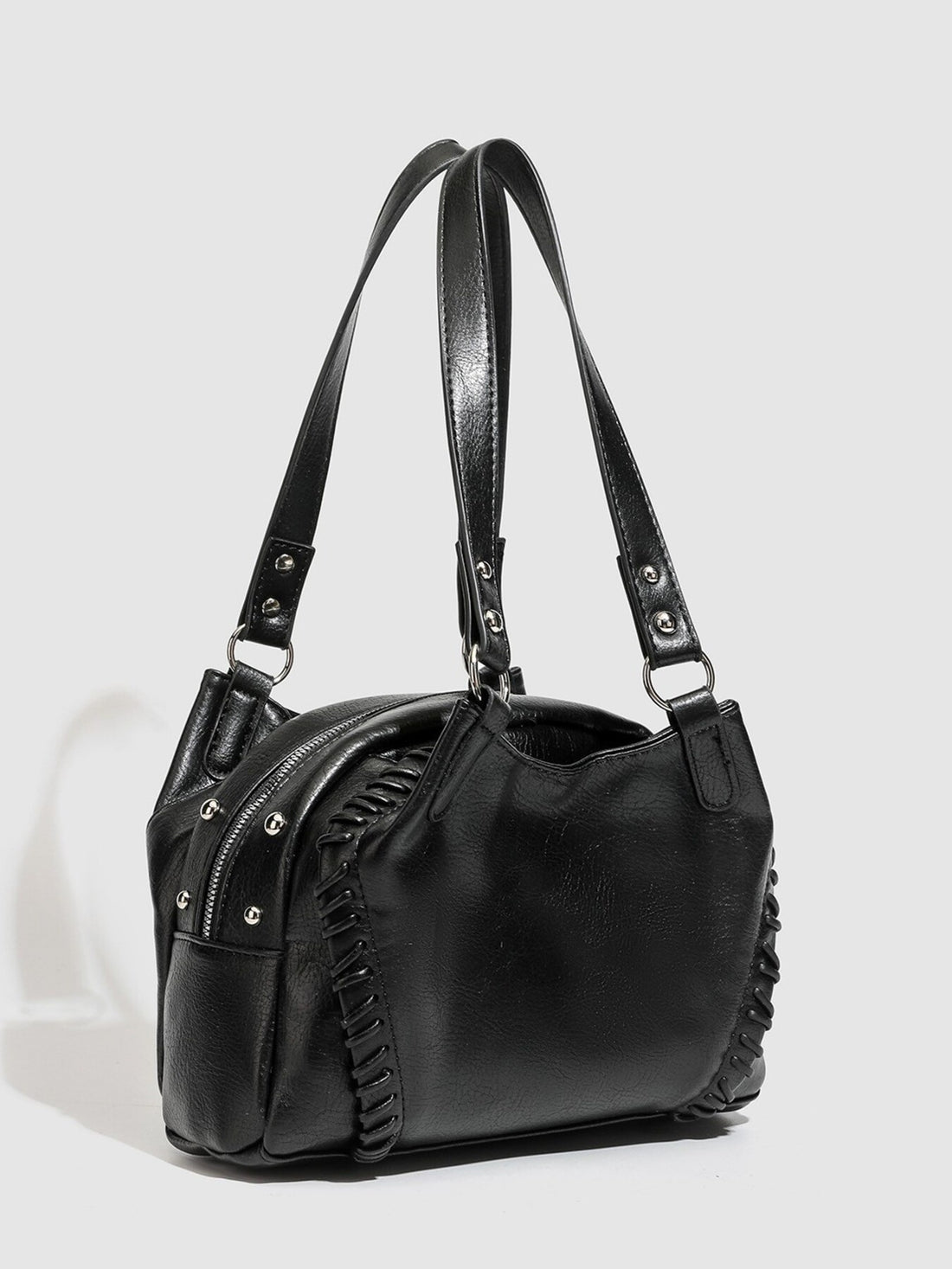 shoulder bag in black featuring woven detail and boxy fit