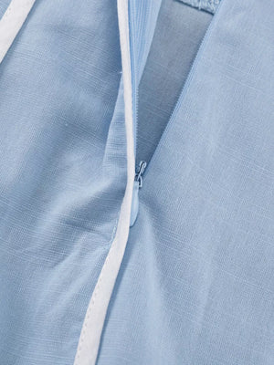 Light blue linen blend dress with white piping and side zipper detail