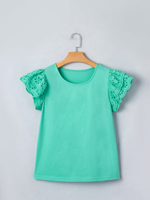 Eyelet lace ruffled cap sleeve top in green with a round neckline.