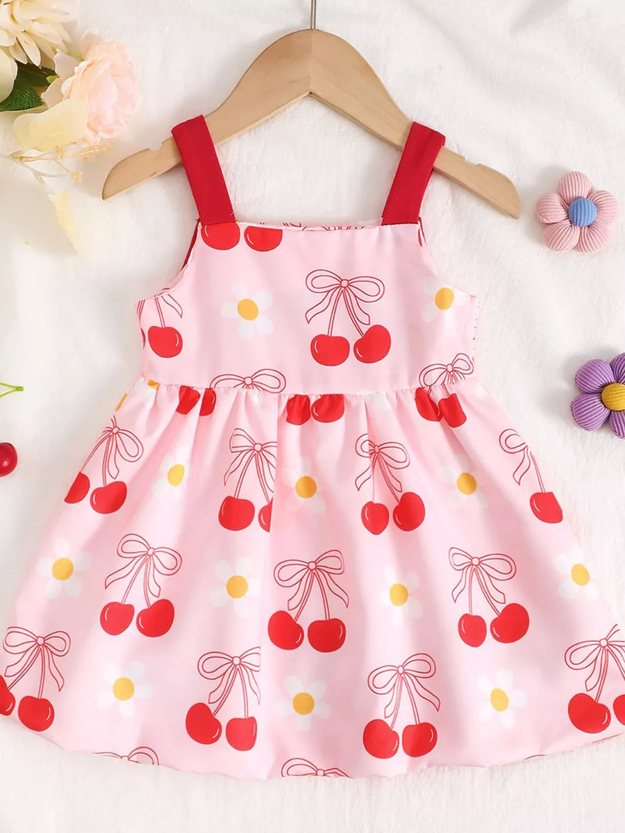 Pink baby dress with cherry and bow print, red straps, cotton.
