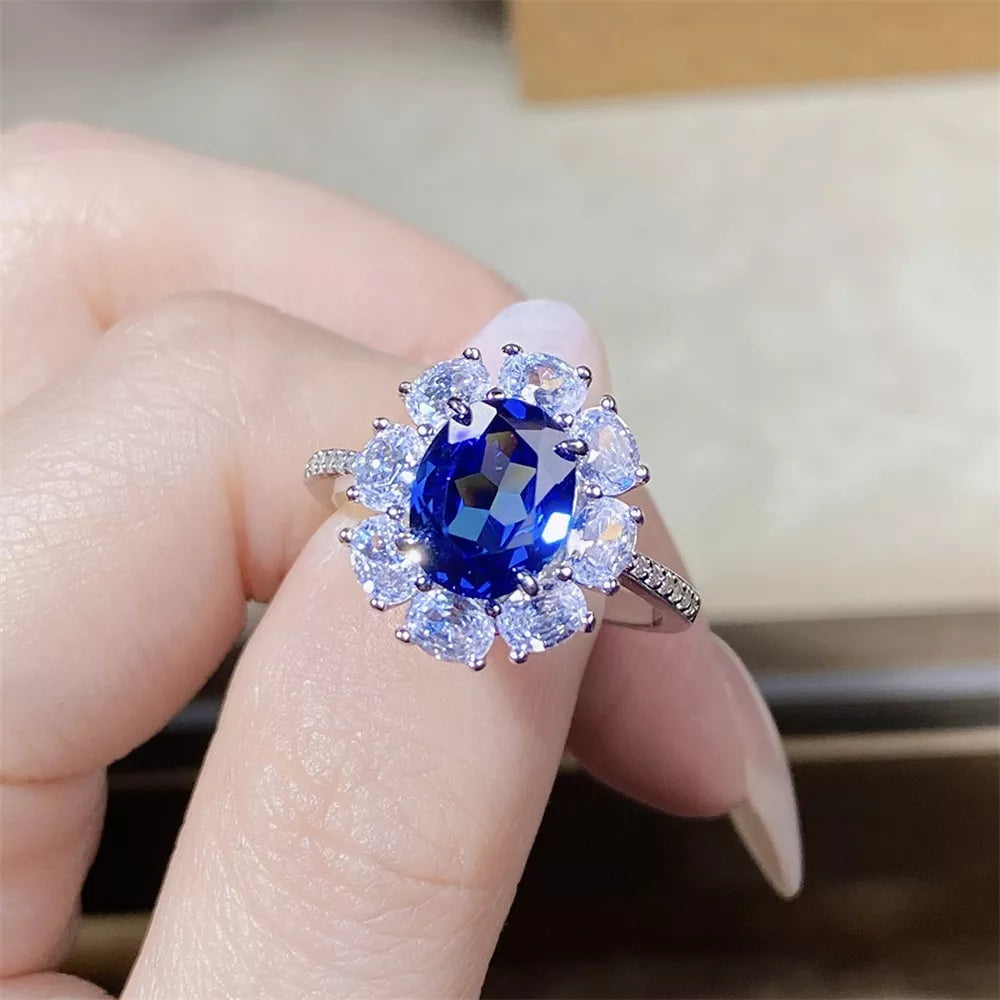 silver ring featuring flower motif and floral