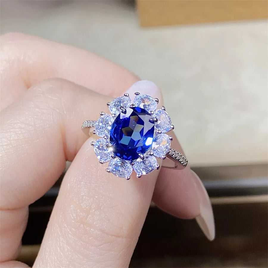 silver ring featuring flower motif and floral