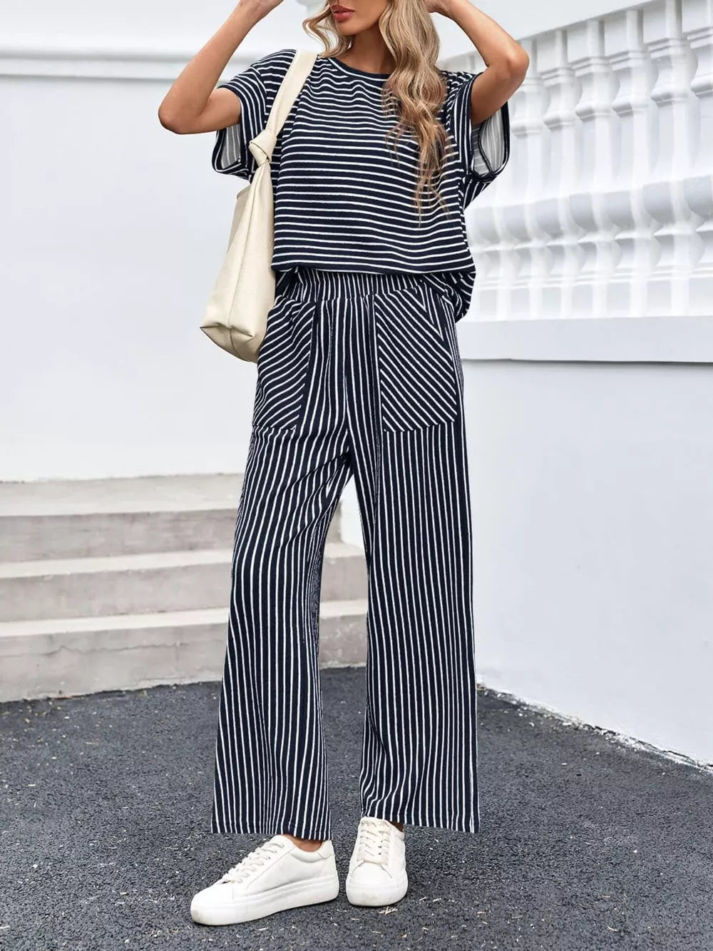 100% polyester Care instructions: Machine wash cold two-piece set in Navy Blue with relaxed silhouette