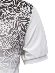 Polo shirt with floral print on left side and white short sleeve.