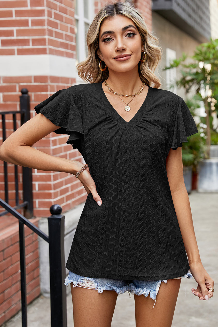 Black eyelet flutter sleeve v-neck top with ruched detail