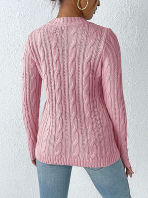 Dusty Pink cable knit mock neck sweater with textured knit details.