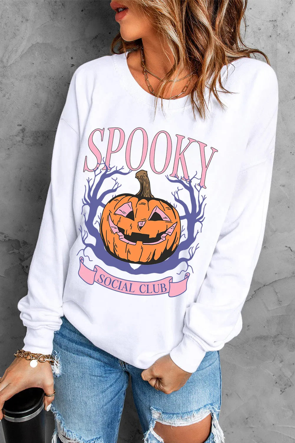 White graphic sweatshirt with spooky pumpkin and Social Club text, crew neck, long sleeves.