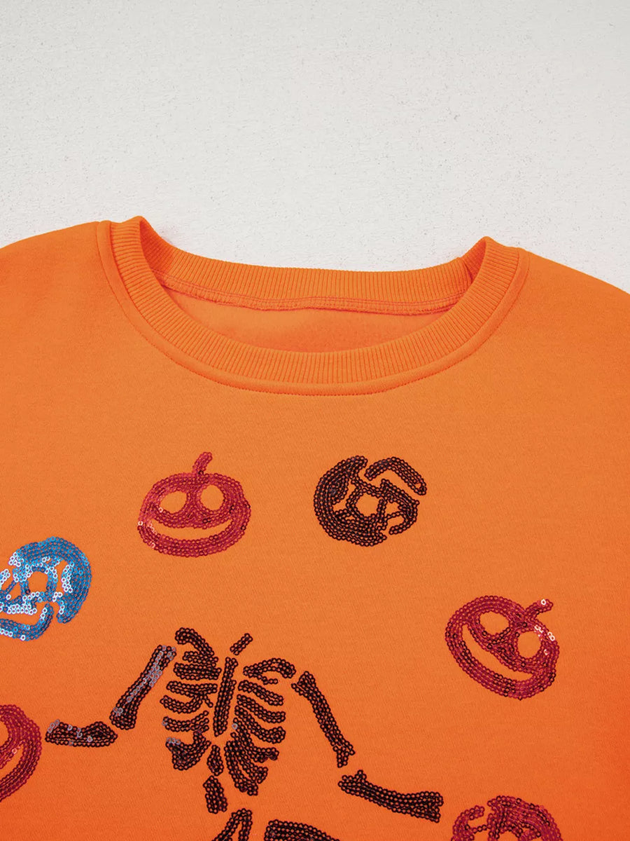 crewneck sweater in Orange with sequin embellishment and hip-length