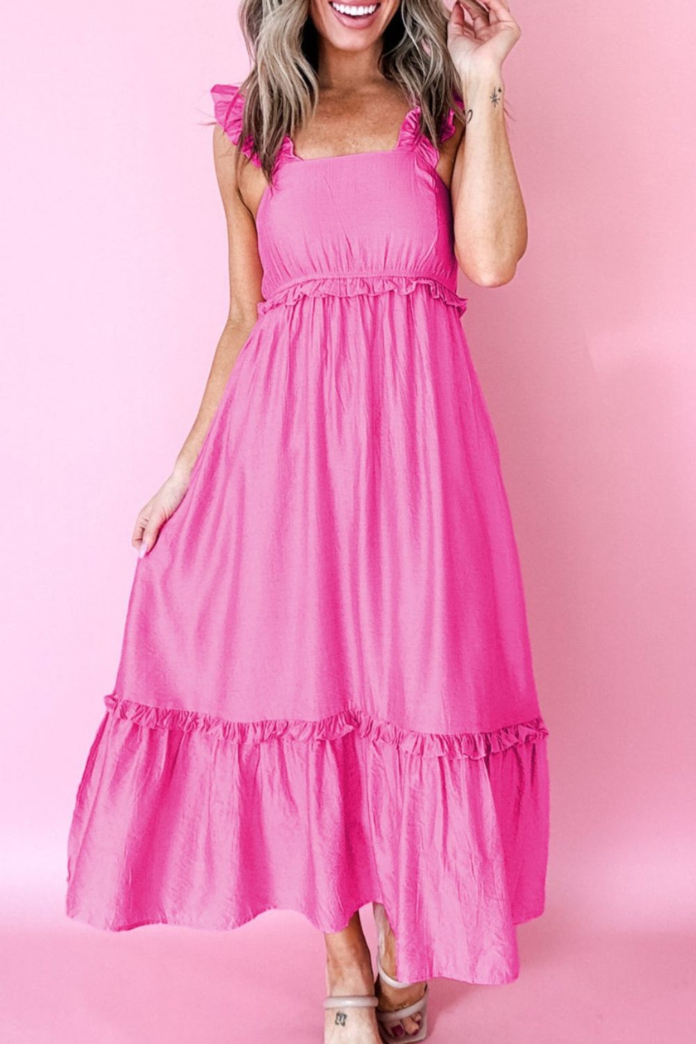 Ruffled sleeveless pink maxi dress with smocked waist and tiered hem