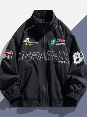 Black bomber jacket with racing graphics and embroidered patches.