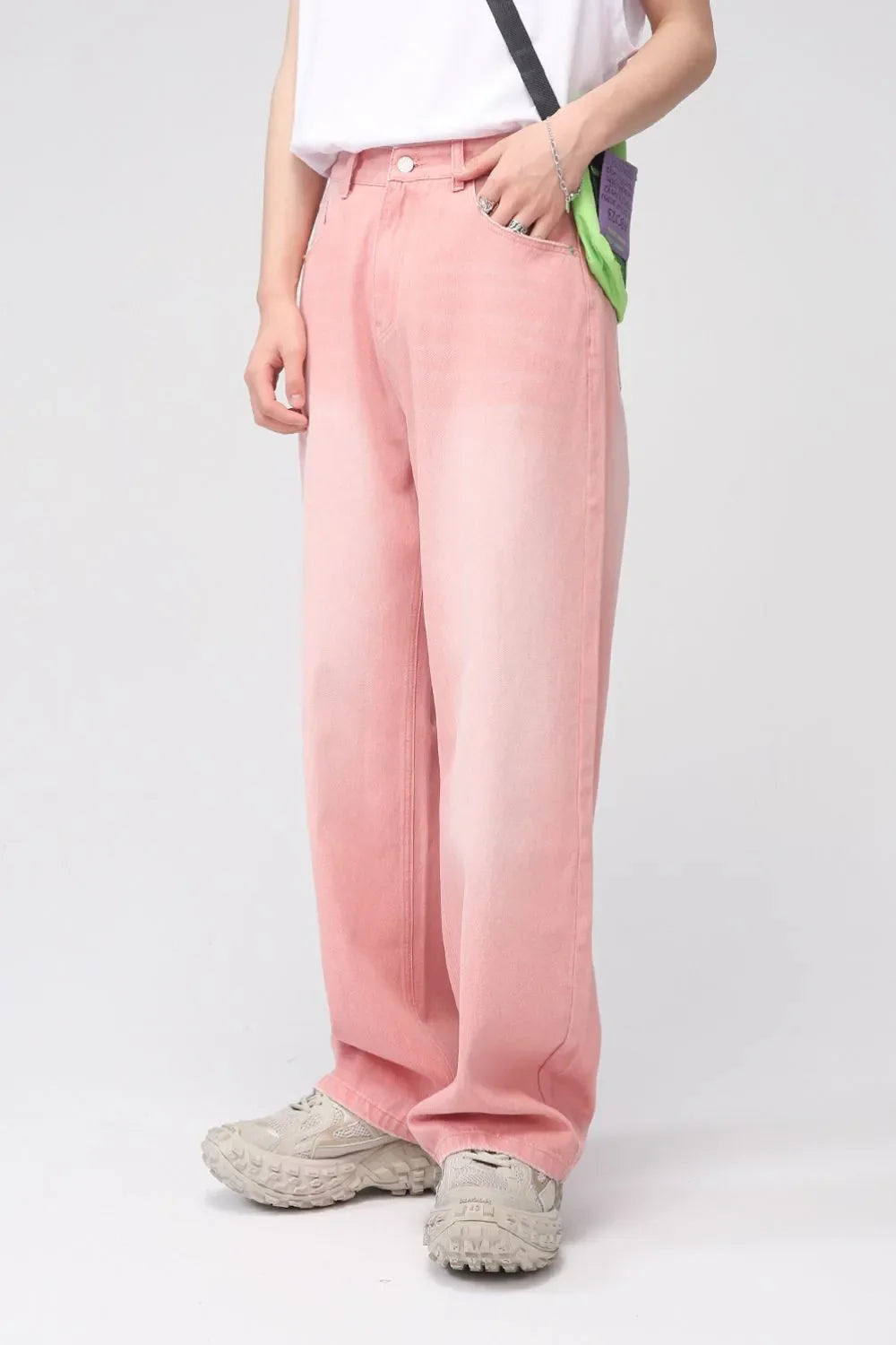 Faded pink wide-leg denim trousers with a casual, relaxed fit.
