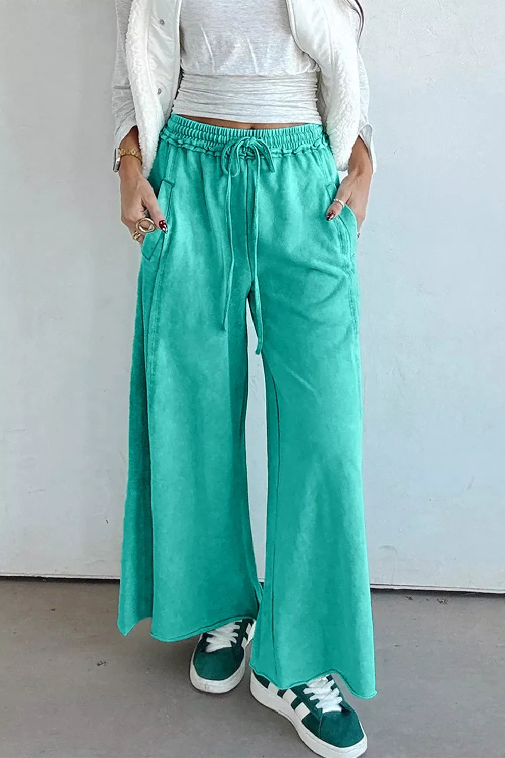 wide-leg pants in teal featuring drawstring and wide-leg fit