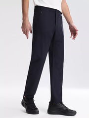 Navy blue sweatpants with zippered pockets and a straight leg fit.