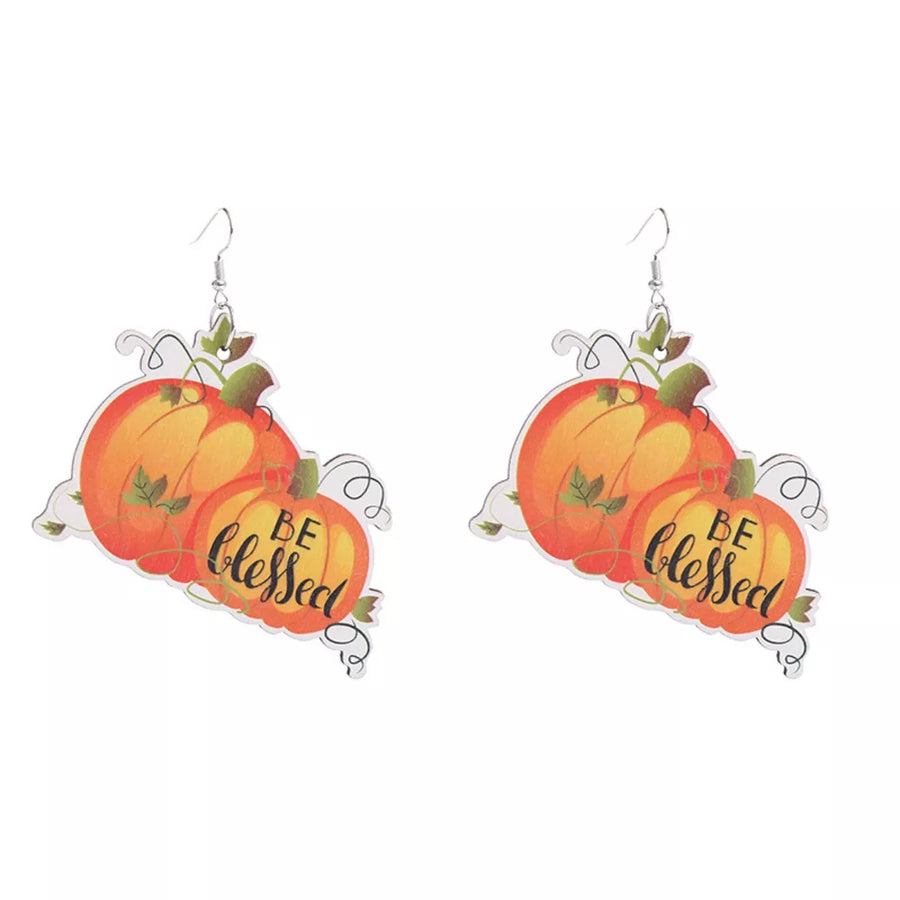 Dangle earrings with orange pumpkins and "BE blessed" text, perfect for Thanksgiving.