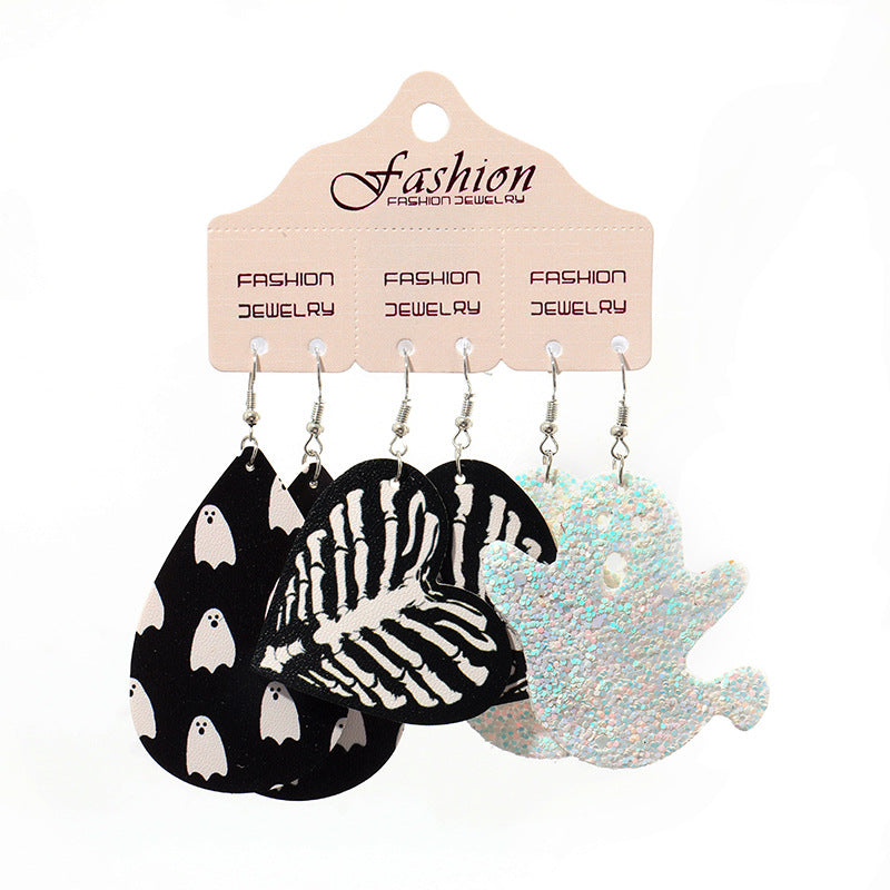 Halloween dangle earrings set with ghost and skeleton hand designs.
