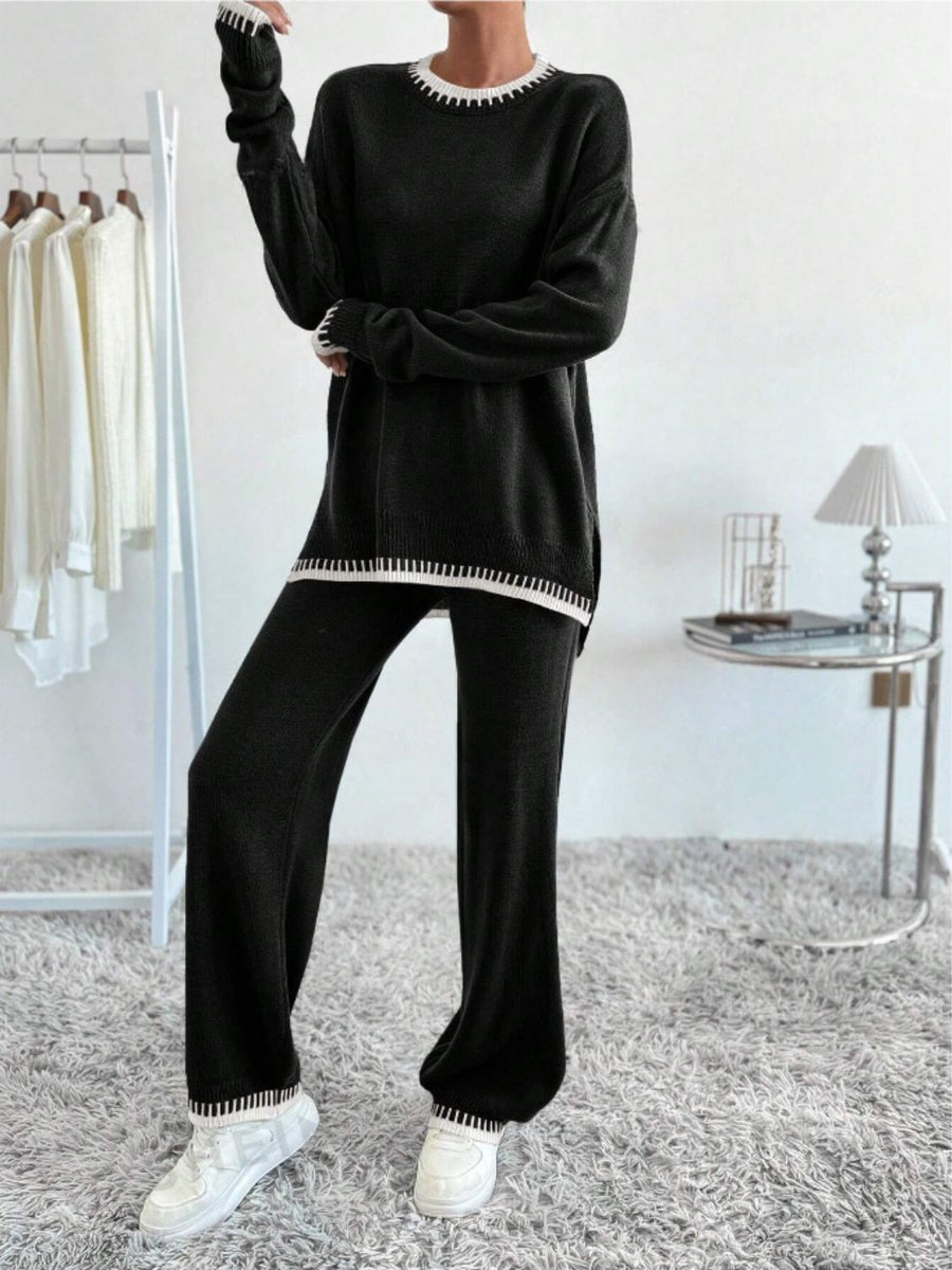 Black knit loungewear set with white contrast trim on neckline, cuffs, and hem.