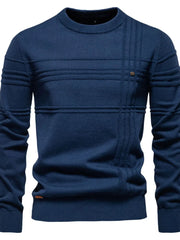 Navy crewneck knit sweater with horizontal and vertical textured panels and a small button detail.