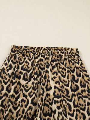 Leopard print two-piece set with elastic waistband and buttoned shirt detail.