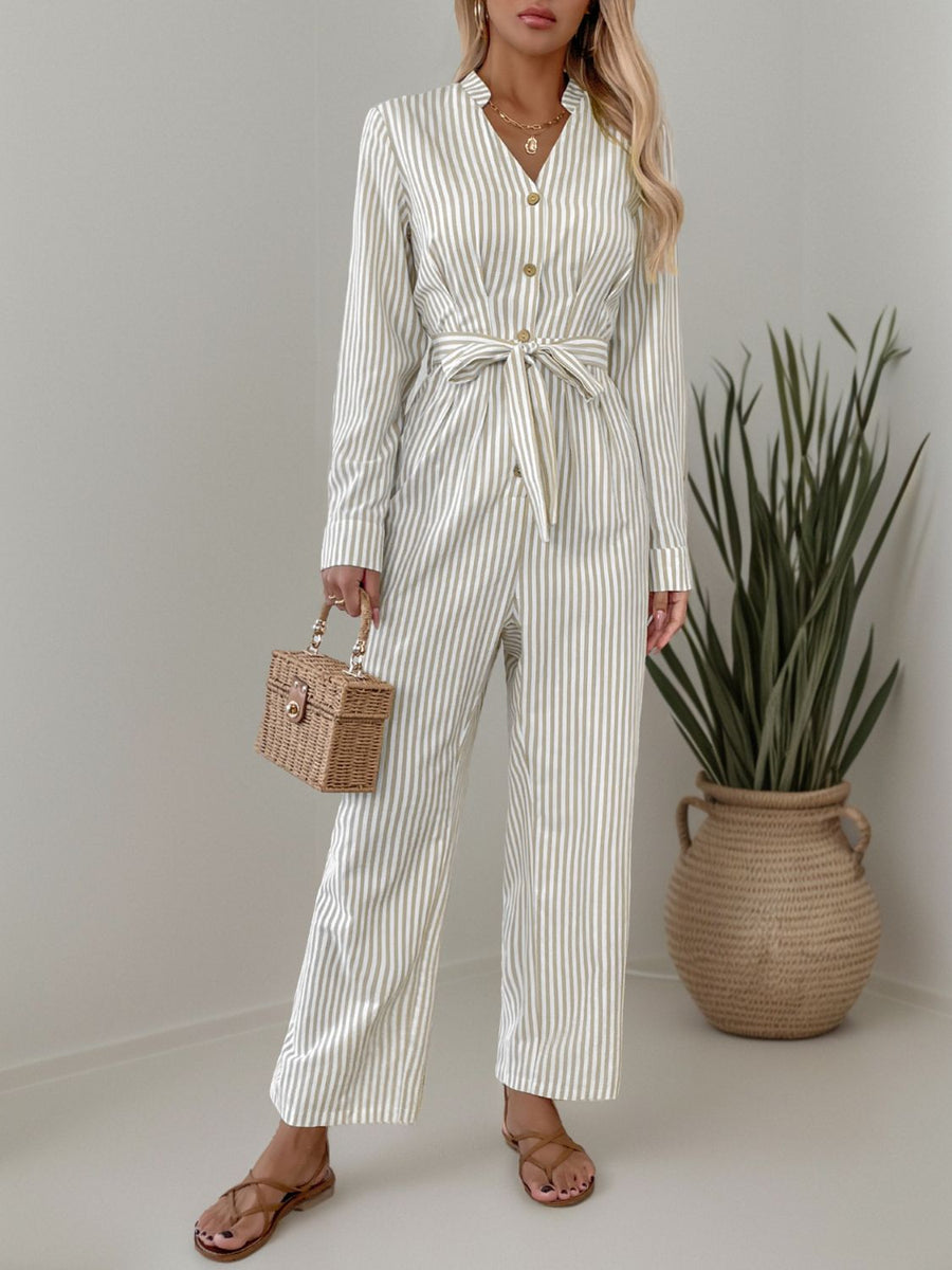 Beige vertical stripe button-down jumpsuit with tie waist and wide legs.