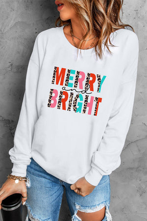 White crewneck sweatshirt with festive leopard print "Merry and Bright" graphic.